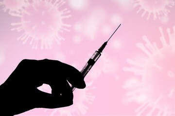 Doctor hand holding a medical syringe, covid-19 variant displayed on a screen