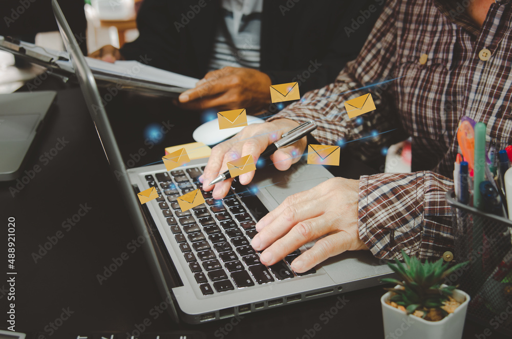 Poster hand business man typing on a computer keyboard.marketing business sending information to customers 