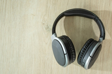 Bluetooth headphones placed on a wooden table