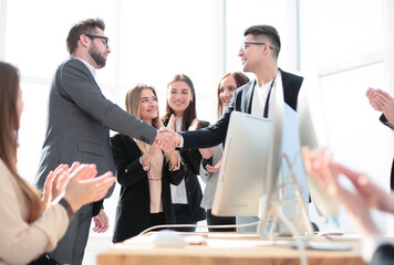 business team congratulating the best employee of the company