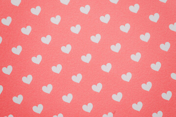 White heart pattern against a red background. © Jun