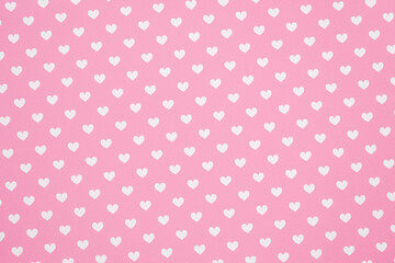 White heart pattern against a pink background.