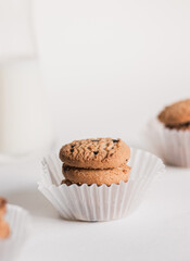 an image of tasty chocolate chip cookies with milk in food stylist theme, dessert restaurant,