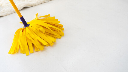 Yellow twist mop made from absorbent synthetic fiber for easy cleaning and quick dry floor at house...