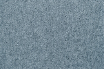 Obraz premium A sheet of dark gray recycled paper or cardboard texture as background