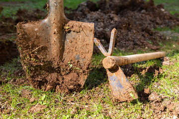 Horticultural shovel and hoe used for digging holes and aerating the soil. Farming shovel in...