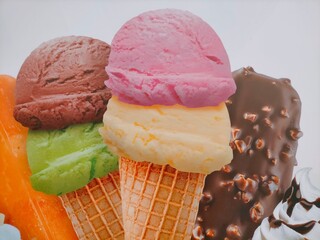 Various ice cream cone with balls of flavors.