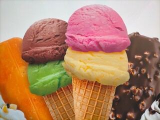 Various ice cream cone with balls of flavors.