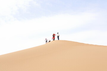 Chinese tourists trekking in Alxa desert