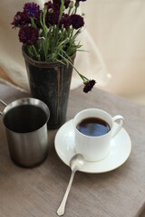 cup of coffee and flowers