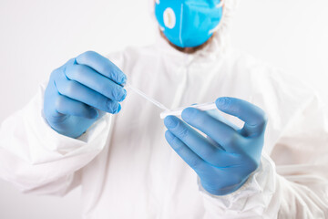 Doctor with laboratory COVID-19 test kit for diagnosis coronavirus infection.