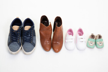 family concept parent father mother son and daughter shoes on white background