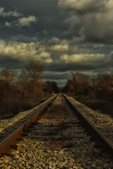Obraz premium Low maintenance railway track and clouds in the sky
