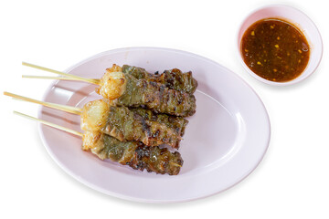 Die cut of grilled meat on skewers on white isolated