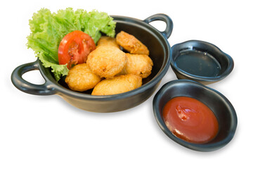 Die cut of chicken nuggets and tomato sauce and lettuce on white isolated