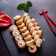 tasty sushi on the black stone