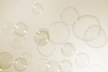 Beautiful Transparent Soap Bubbles Texture on a Yellow Background.	