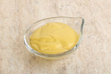 Organic mustard sauce in the bowl