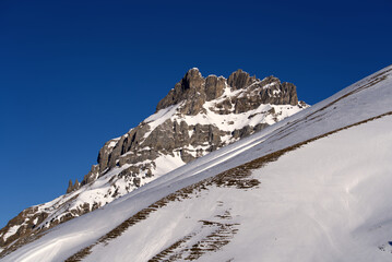 Aerial view of mountain panorama at the Swiss Alps seen from ski resort Engelberg, focus on...