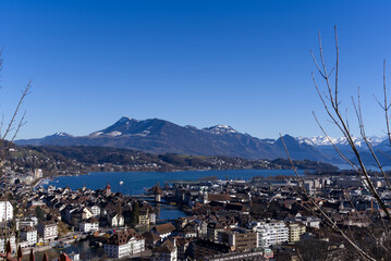 Aerial view over City of Luzern seen form local mountain G&uuml;tsch on a sunny winter day, focus on background. Photo taken February 9th, 2022, Lucerne, Switzerland.