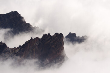 Rocky cliffs in the fog. Caldera de Taburiente National Park. La Palma. Canary Islands. Spain.