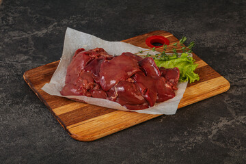 Raw chicken liver over board