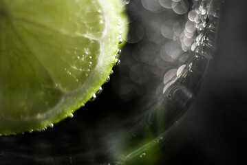 Close up view of a lemon or lime slice in the water