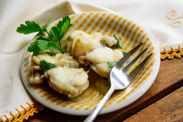 fish in green sauce with peas and parsley