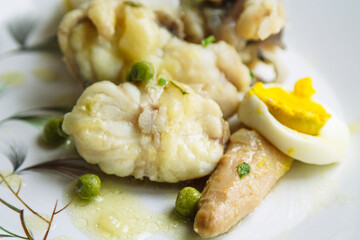 fish in green sauce with peas and parsley