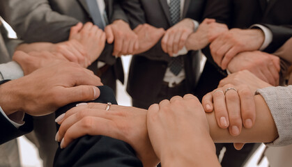 close up.business team showing their unity