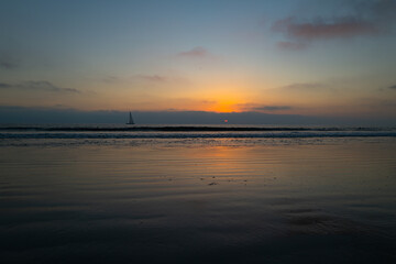Fototapeta na wymiar Sunset at the sea. Sunrise at beach. Colorful ocean beach sunrise.