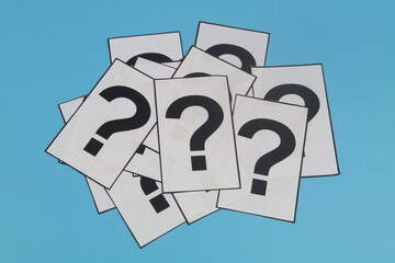 Many cards with question marks on blue background