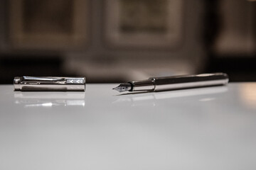 A selective focus shot of a pen on a table