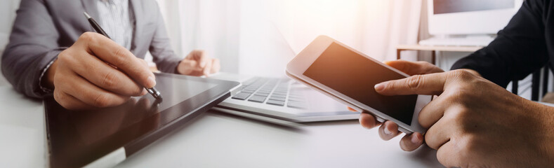 man using digital tablet computer, close up of the hand, business and technology background with copy space