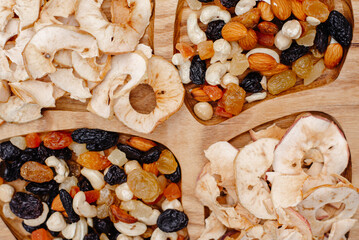 dried fruit and nuts on a wooden background