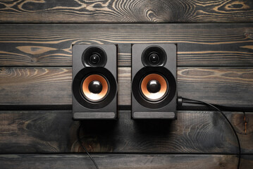 Computer musical speakers on the table flat lay background.