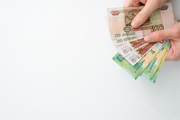 Concept finance, payment, poverty. Hands holding money on white background, copy space. Human...
