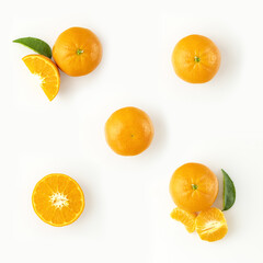 Fresh ripe whole and sliced mandarin, tangerine or clementine isolated on white background