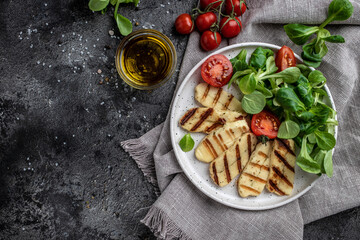 vegeterian salad with fried halloumi and tomatoes, closeup, keto ketogenic diet. Delicious...