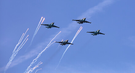 Su25 frogfoot attack aircraft close up in the sky with clouds.