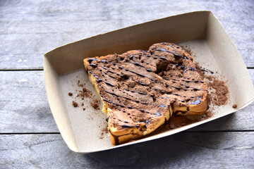 Honey Toast Chocolate bread, bread toasted on a dark wood background.  bakery shop