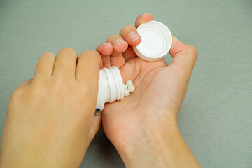 You have a handful of vitamins in your hand to boost immunity, vitamin C. Prevention of diseases. The virus.