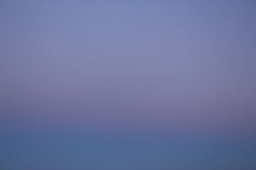 dawn or dusk texture or wallpaper. Natural sky background. Deep indigo to light lilac or purple sky gradient (Nice, France)