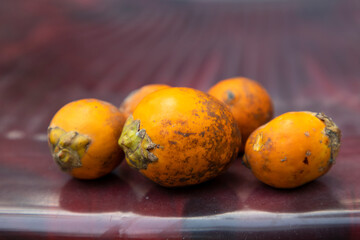 Ripe betel Nuts on Glossy Plastic Floor