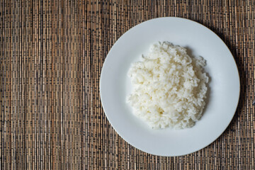 Rice on white plate shown from the top