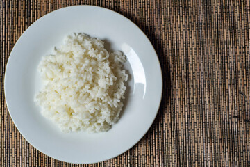 Rice on white plate shown from the top