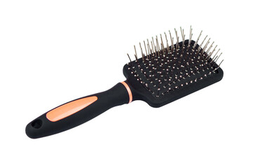 Massage comb for combing hair. Plastic brush with metal corners for detangling hair. On an isolated white background.close-up.