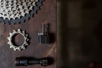 Fototapeta na wymiar Bicycle tools on the wooden table with negative space for words