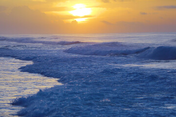 beautiful waves and clouds on the ocean shore 