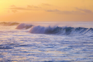 beautiful waves and clouds on the ocean shore 